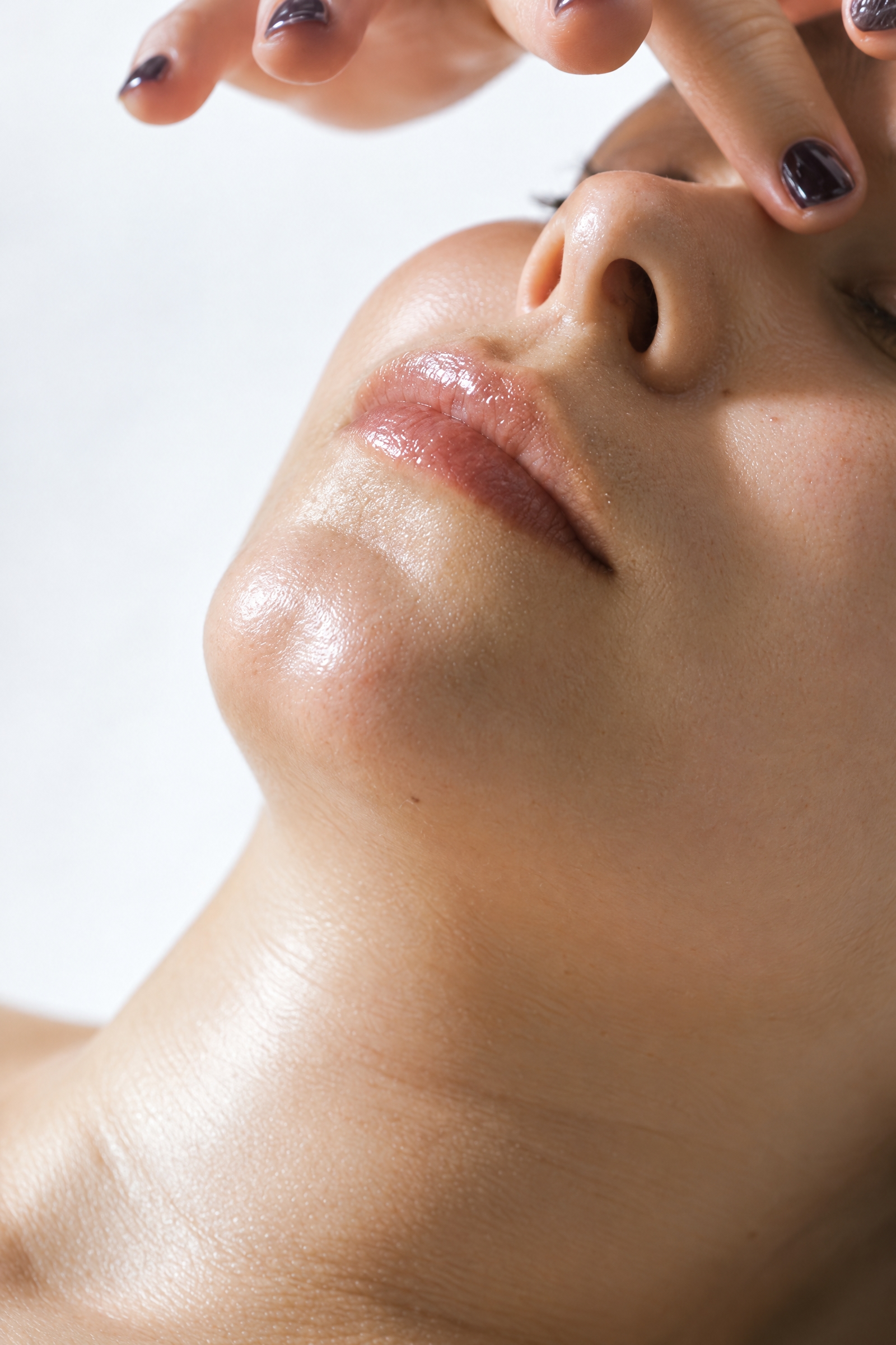 Therapist performing a facial treatment