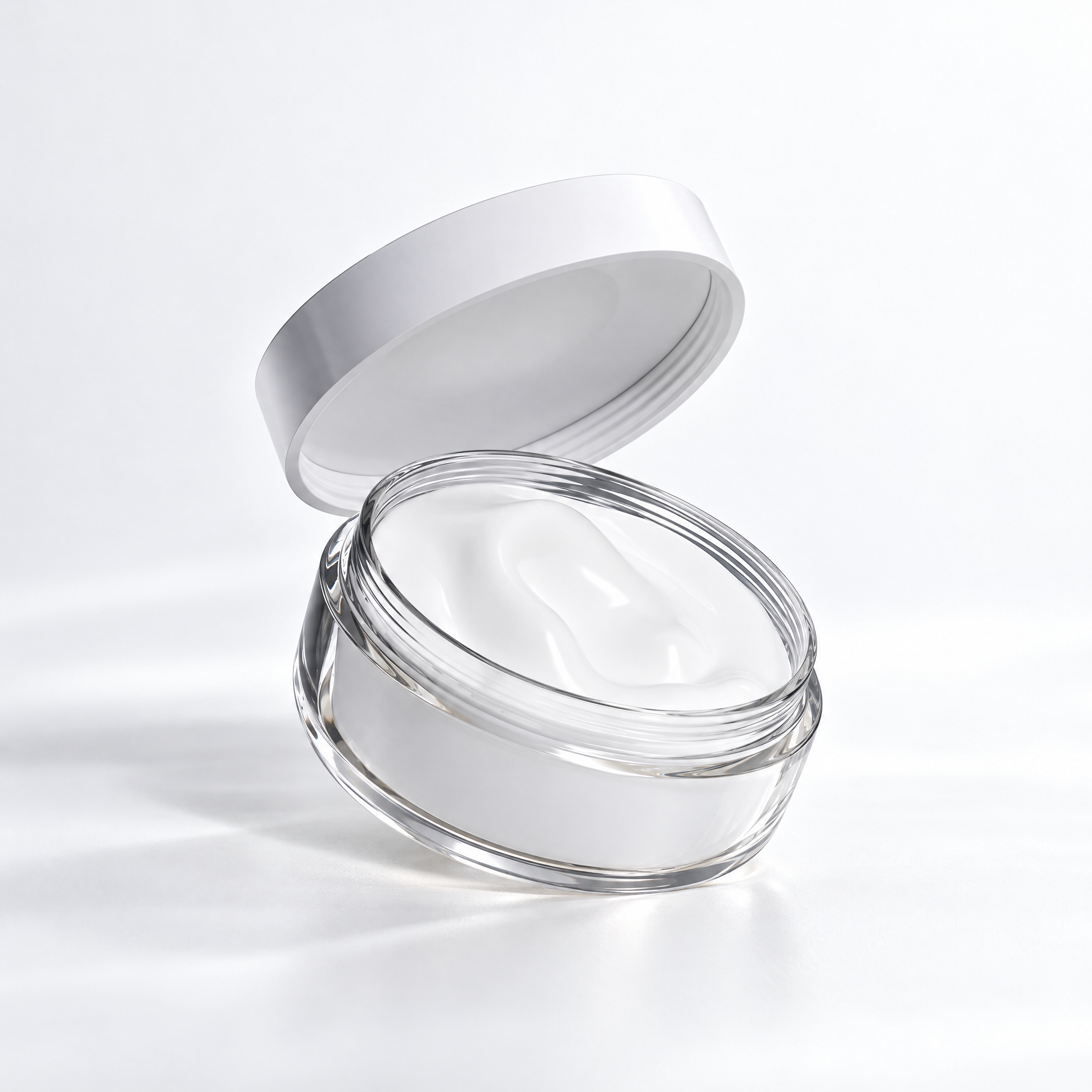 An open jar of white face cream