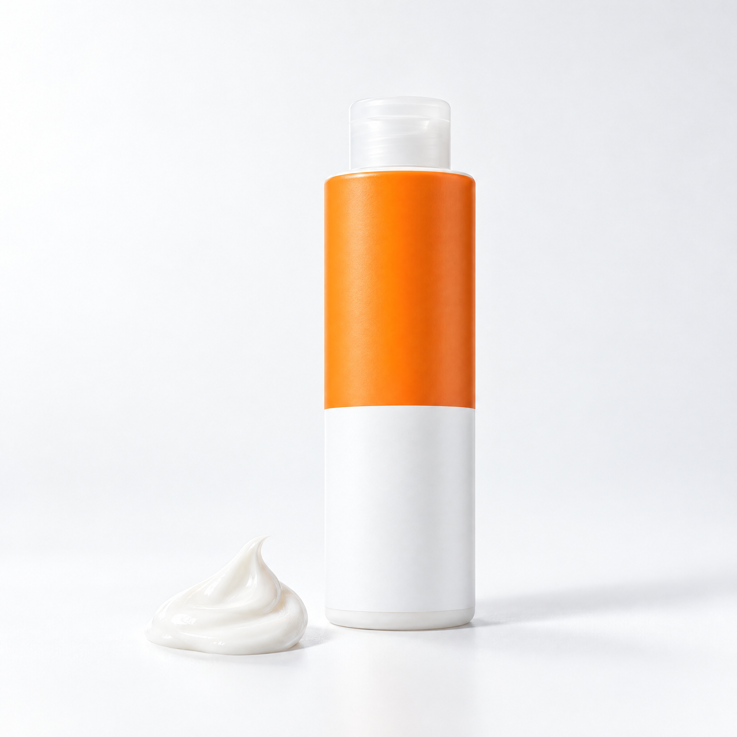 A hand holding a tube of sunscreen